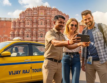 A Vijay Raj Tours driver helping a happy tourist couple take a photo in Jaipur