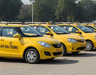 The modern fleet of yellow taxis from Vijay Raj Tours